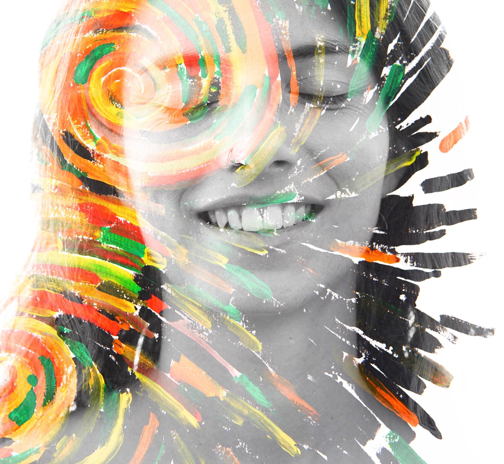 Paintography. Double exposure portrait of a healthy, happy woman combined with impressionistic style flowing brush strokes which explode with color and life