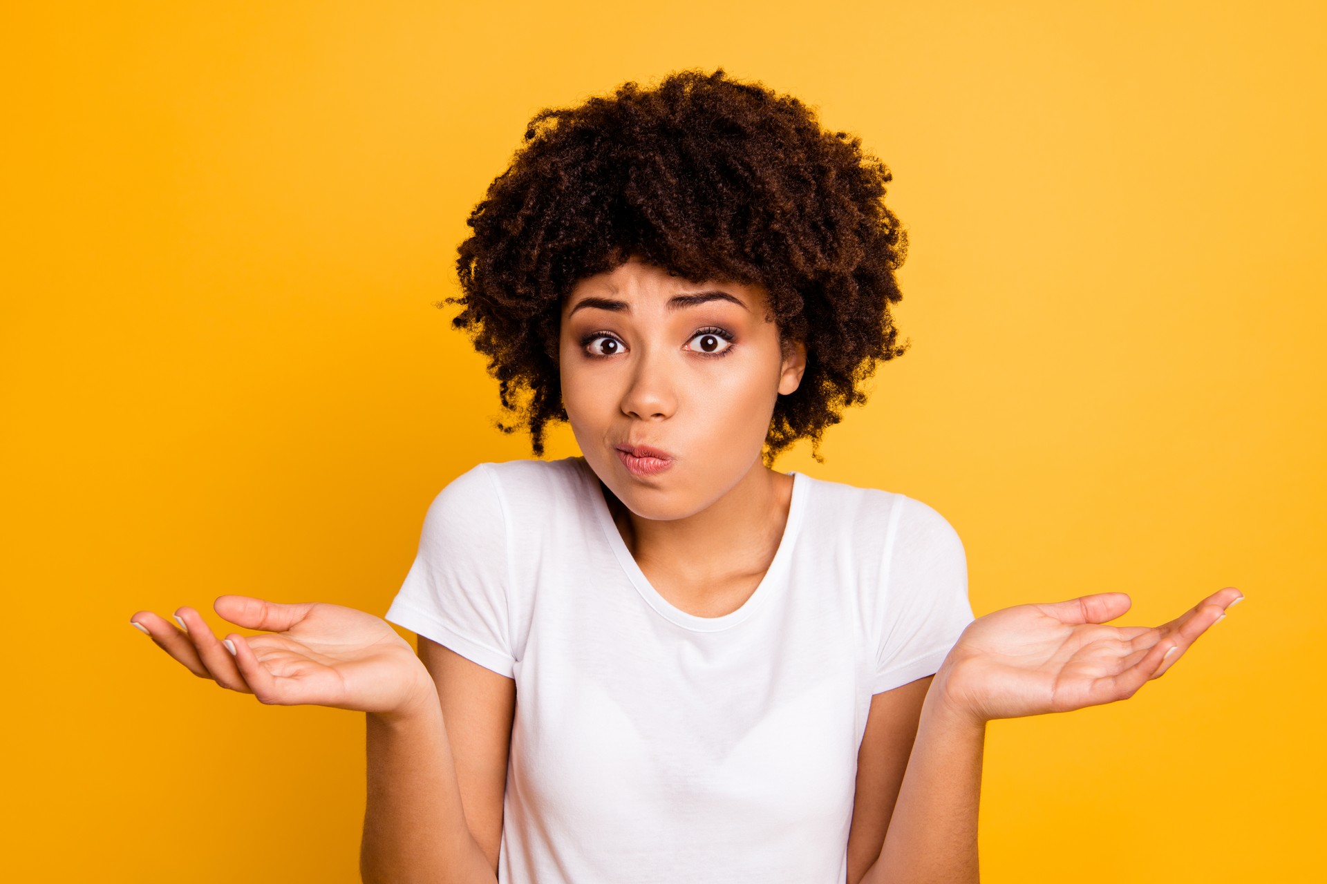 Close-up portrait of her she nice attractive puzzled ignorant wavy-haired girl showing gesture no information isolated on bright vivid shine yellow background